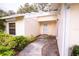 View of the home's covered entryway and a portion of the front yard landscaping at 4018 Oakhurst Dr # 3181, Sarasota, FL 34233