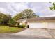 Charming single-story villa with a two-car garage and a well-maintained front yard with mature landscaping at 4018 Oakhurst Dr # 3181, Sarasota, FL 34233
