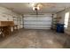Spacious garage featuring an automatic door, overhead lighting, and ample room for parking and storage at 4018 Oakhurst Dr # 3181, Sarasota, FL 34233