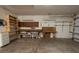 Functional garage space with a workbench, shelving, and ample storage for tools and equipment at 4018 Oakhurst Dr # 3181, Sarasota, FL 34233