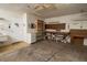 Well-organized garage featuring built-in shelves, a workbench, and convenient access to a laundry sink at 4018 Oakhurst Dr # 3181, Sarasota, FL 34233