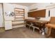Organized garage featuring a workbench, shelving, and electrical panel for added functionality at 4018 Oakhurst Dr # 3181, Sarasota, FL 34233