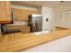 A bright kitchen featuring stainless steel appliances and wood countertops at 4018 Oakhurst Dr # 3181, Sarasota, FL 34233