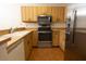 This updated kitchen boasts stainless steel appliances, wood cabinets, and plenty of counter space at 4018 Oakhurst Dr # 3181, Sarasota, FL 34233