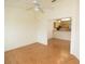 Open living area with tile floors, ceiling fan, and views of the kitchen at 4018 Oakhurst Dr # 3181, Sarasota, FL 34233