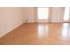 Living room featuring tile flooring, a large window, and access to the lanai at 4018 Oakhurst Dr # 3181, Sarasota, FL 34233