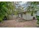 Backyard featuring an above ground pool, brick patio, and tropical landscaping around the back of the house at 4116 34Th E Ave, Bradenton, FL 34208