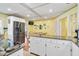 Bright kitchen with white cabinetry, stainless steel appliances, and a convenient breakfast bar at 4116 34Th E Ave, Bradenton, FL 34208