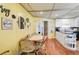 Charming eat-in kitchen with wood floors, decorative wall art, and cozy seating area at 4116 34Th E Ave, Bradenton, FL 34208
