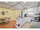 Cozy eat-in kitchen featuring granite countertops, stylish cabinets, and a sunny breakfast nook at 4116 34Th E Ave, Bradenton, FL 34208