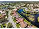 Beautiful aerial view of waterfront homes in a well-maintained, lushly landscaped community at 4173 Hearthstone Dr, Sarasota, FL 34238