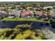 Aerial view showcasing backyard views, with pools and waterways throughout the neighborhood at 4173 Hearthstone Dr, Sarasota, FL 34238