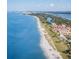 Stunning aerial view of the coastline with pristine beaches and beautiful waterfront properties at 4173 Hearthstone Dr, Sarasota, FL 34238