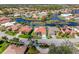 Aerial view of a well-maintained home with a red tile roof and lush landscaping at 4173 Hearthstone Dr, Sarasota, FL 34238