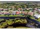 A picturesque backyard view with a lake and well-maintained landscaping, creating a serene outdoor space at 4173 Hearthstone Dr, Sarasota, FL 34238
