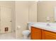 Cozy bathroom with wood cabinets, toilet, and a mirror; perfect for any home at 4173 Hearthstone Dr, Sarasota, FL 34238