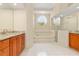 Bright bathroom with granite countertops, tiled floors, and glass enclosed shower at 4173 Hearthstone Dr, Sarasota, FL 34238