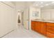 Spacious bathroom with double closets and vanity with granite countertop at 4173 Hearthstone Dr, Sarasota, FL 34238