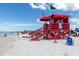 Picturesque beach scene with lifeguard tower, white sand, and ocean views creating an idyllic coastal setting at 4173 Hearthstone Dr, Sarasota, FL 34238