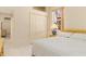 Bedroom with a large window, closet, and view of en-suite bathroom at 4173 Hearthstone Dr, Sarasota, FL 34238