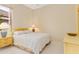 Cozy bedroom with a queen bed and neutral decor at 4173 Hearthstone Dr, Sarasota, FL 34238