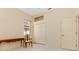 Clean bedroom with tile floor, a window, closet doors, and a chair with a writing table at 4173 Hearthstone Dr, Sarasota, FL 34238