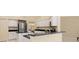Open-concept kitchen with granite countertops, stainless steel appliances, and ample storage at 4173 Hearthstone Dr, Sarasota, FL 34238