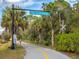 A scenic view of the Legacy Trail with lush landscaping and clear signage at 4173 Hearthstone Dr, Sarasota, FL 34238