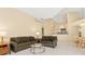 Open concept living space with neutral tones, tile flooring, and ample natural light at 4173 Hearthstone Dr, Sarasota, FL 34238