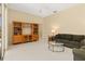 Cozy living room with tile flooring, built in shelving and neutral color palette at 4173 Hearthstone Dr, Sarasota, FL 34238
