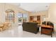 Bright living room with seamless access to the pool through large sliding glass doors at 4173 Hearthstone Dr, Sarasota, FL 34238