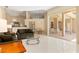 Spacious living room with tile floors leading to outdoor patio at 4173 Hearthstone Dr, Sarasota, FL 34238