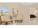 Cozy living room area featuring plenty of natural light from two large arched windows at 4173 Hearthstone Dr, Sarasota, FL 34238
