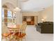 Open floor plan with living room leading to lanai overlooking the pool and lake at 4173 Hearthstone Dr, Sarasota, FL 34238