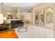 Spacious living room with tile floors leading to outdoor patio at 4173 Hearthstone Dr, Sarasota, FL 34238