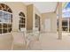 Covered patio with seating area, perfect for relaxing or entertaining guests at 4173 Hearthstone Dr, Sarasota, FL 34238