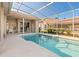 Screened-in pool area with comfortable seating for outdoor enjoyment at 4173 Hearthstone Dr, Sarasota, FL 34238
