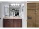 A stylish bathroom featuring granite countertops and a tiled glass shower at 4348 Bowling Green Cir # 9, Sarasota, FL 34233