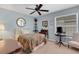 Bright bedroom featuring neutral walls, carpet floors and a ceiling fan at 4348 Bowling Green Cir # 9, Sarasota, FL 34233