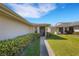 Close-up of a well-maintained home exterior featuring tidy landscaping and a welcoming front entryway at 4348 Bowling Green Cir # 9, Sarasota, FL 34233
