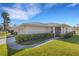 Charming home with a well-manicured lawn, tidy landscaping, and a welcoming front entrance with a sidewalk at 4348 Bowling Green Cir # 9, Sarasota, FL 34233