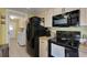 Bright kitchen with stainless steel appliances and yellow walls at 4348 Bowling Green Cir # 9, Sarasota, FL 34233