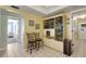Bright breakfast nook with glass display cabinet and tile floors at 4348 Bowling Green Cir # 9, Sarasota, FL 34233