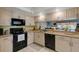 Kitchen with bright cabinets, granite countertops and stainless appliances at 4348 Bowling Green Cir # 9, Sarasota, FL 34233