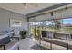 Relaxing sunroom with tile flooring, large windows, and peaceful water view; ideal for leisure at 4348 Bowling Green Cir # 9, Sarasota, FL 34233