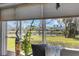 Scenic view from the sunroom provides a tranquil view of the water, and the outdoors at 4348 Bowling Green Cir # 9, Sarasota, FL 34233