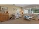 Bright living room with matching sofas, side table, and sunlit window at 4348 Bowling Green Cir # 9, Sarasota, FL 34233