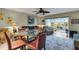 Open-concept living room with plenty of seating and natural light at 4348 Bowling Green Cir # 9, Sarasota, FL 34233