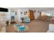 Open concept living room that flows from entry to dining room to Gathering room at 4348 Bowling Green Cir # 9, Sarasota, FL 34233