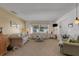 A comfortable living room with sofa, love seat and lamps near a sunlit window at 4348 Bowling Green Cir # 9, Sarasota, FL 34233